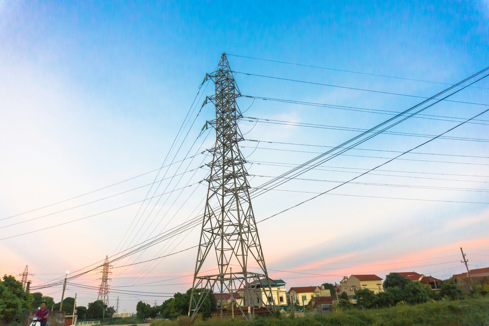 black electric tower under blue sky during daytime